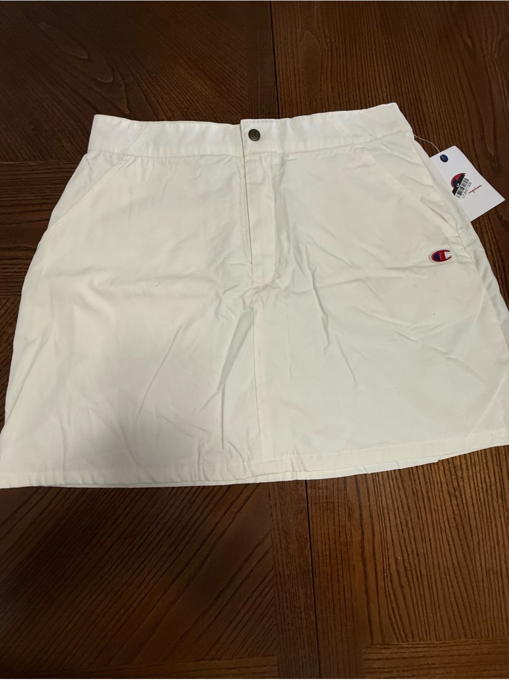 Champion Campus Skirt NWT. Size 8. DAMAGED.